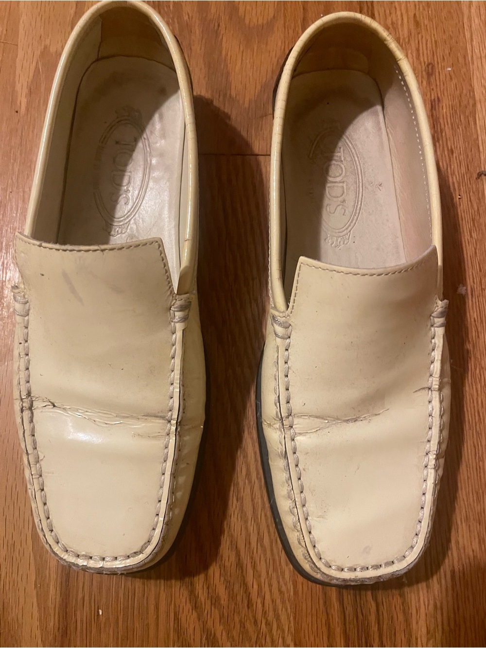 Tod's Cream Leather Slip-On Loafers with Moc Toe Stitching